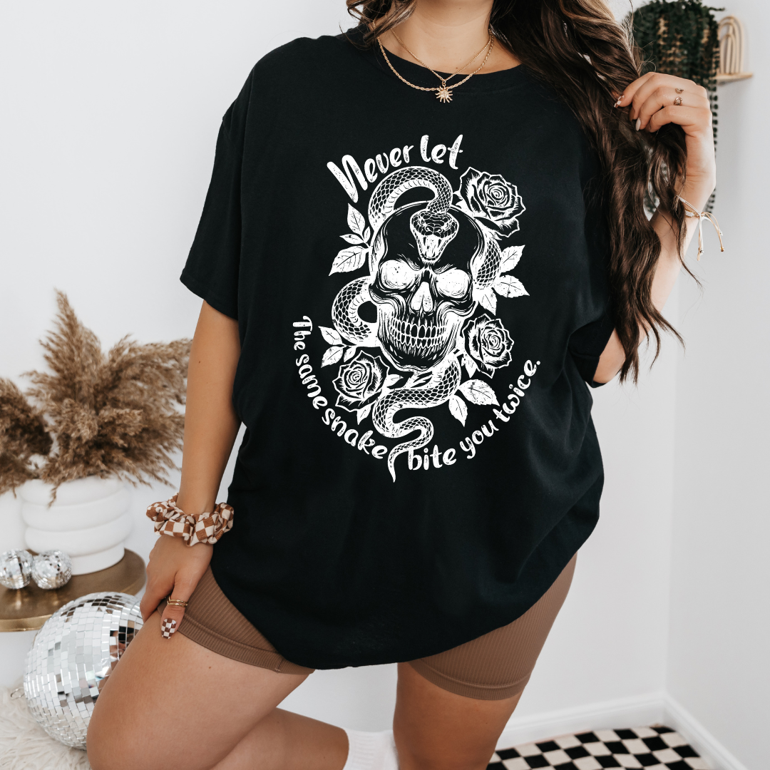 NEVER LET THE SAME SNAKE BITE YOU TWICE GRAPHIC TEE