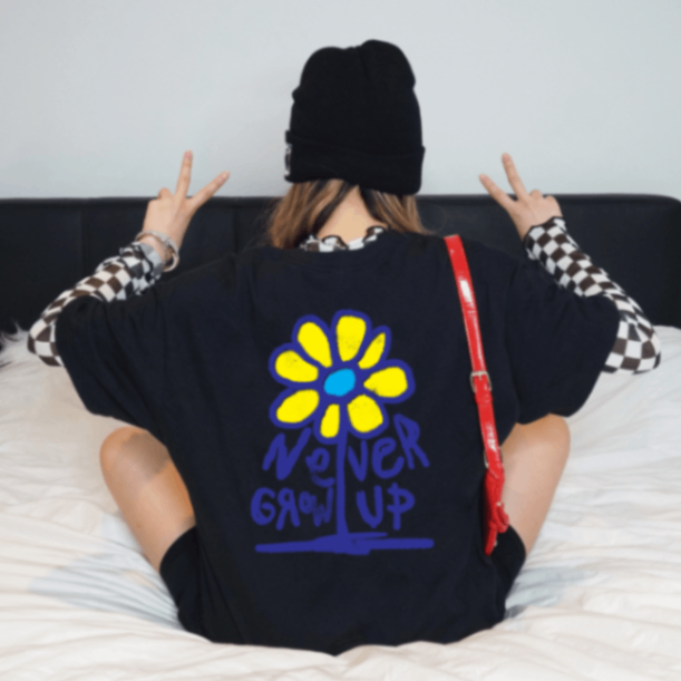 NEVER GROW UP GRAPHIC TEE